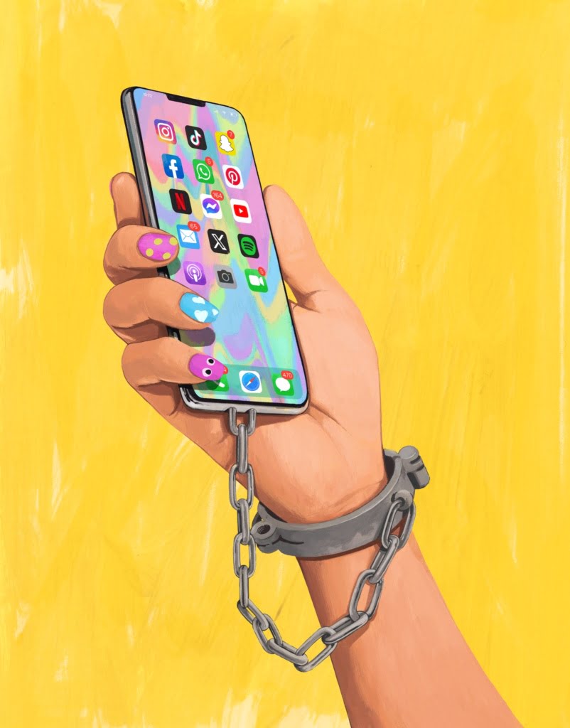 Hand som håller en mobiltelefon, med handfängsel mellan arm och telefon